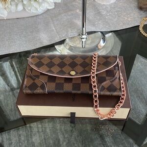 Like new damier long wallet with pink accents.